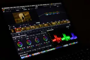 Creator editing video on a laptop with editing software
